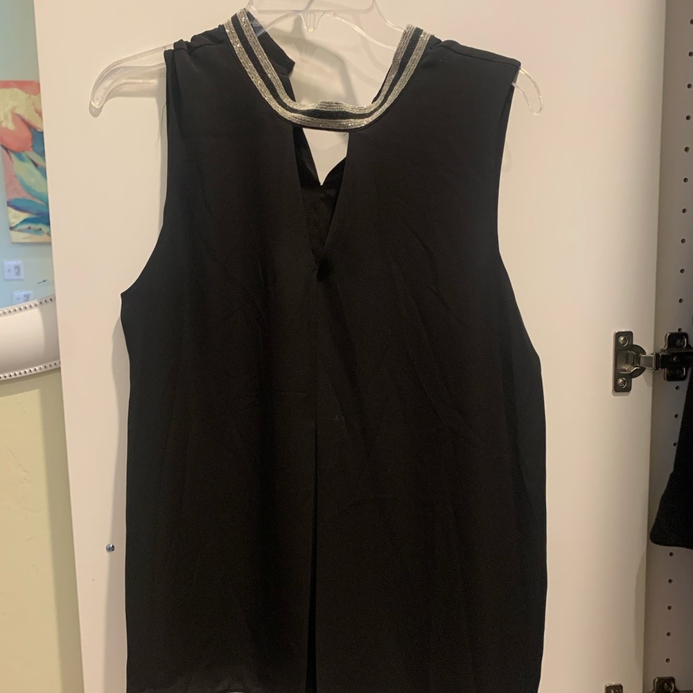Black sleeveless blouse with beaded neckline